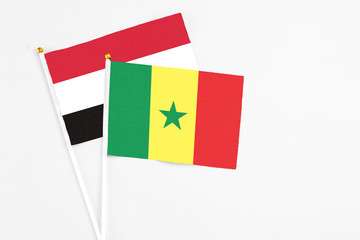 Senegal and Egypt stick flags on white background. High quality fabric, miniature national flag. Peaceful global concept.White floor for copy space.
