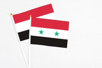 Syria and Egypt stick flags on white background. High quality fabric, miniature national flag....