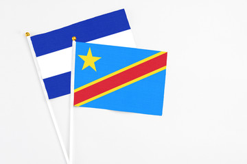 Congo and El Salvador stick flags on white background. High quality fabric, miniature national flag. Peaceful global concept.White floor for copy space.