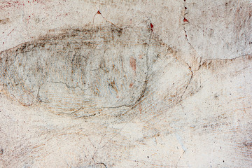 Texture of a concrete wall with cracks and scratches which can be used as a background