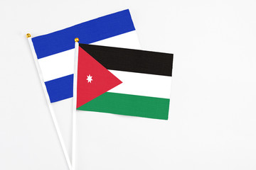 Jordan and El Salvador stick flags on white background. High quality fabric, miniature national flag. Peaceful global concept.White floor for copy space.