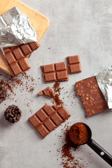 Chocolate bar on cement background