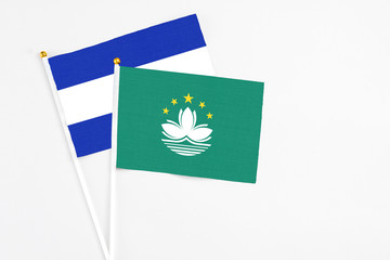 Macao and El Salvador stick flags on white background. High quality fabric, miniature national flag. Peaceful global concept.White floor for copy space.