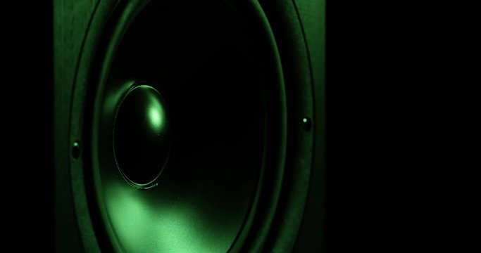 CLOSE UP colorful moving sub-woofer music speakers vibrating membrane