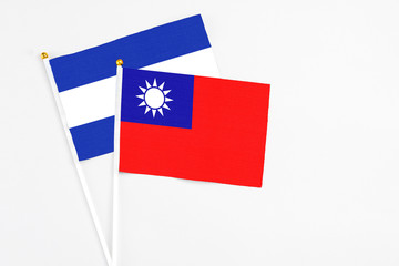 Taiwan and El Salvador stick flags on white background. High quality fabric, miniature national flag. Peaceful global concept.White floor for copy space.