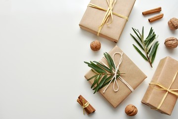 Zero waste gift wrapping with craft paper and natural decorations, top view, copy space.