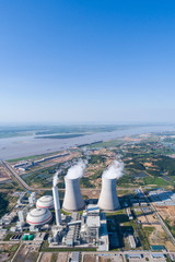 aerial view of modern thermal power plant by riverside