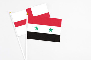 Syria and England stick flags on white background. High quality fabric, miniature national flag....