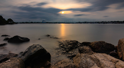 sunset on coast of sea