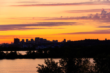 Fototapeta na wymiar Sunset over the Dnieper river in Kiev, Ukraine