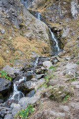 Polikarya waterfall in the Caucasus mountains near Sochi, Russia. Cloudy day 26 October 2019