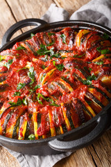 Greek cuisine Briam vegetable mix close-up in a pan. vertical