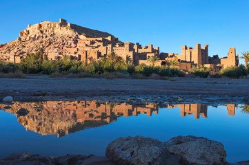 Fototapeta na wymiar Kasbah Ait Ben Haddou with reflection in the river.