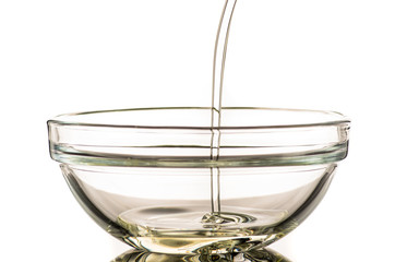 Pour sunflower oil into a napkin holder, flow and splash