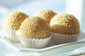 Fried sesame ball enclosure with black sesame paste inside, a Chinese style dessert