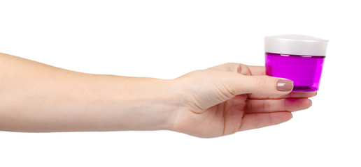 Face cream in plastic purple container. Isolated on white.