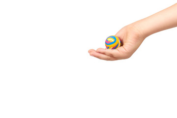Children hand with color rubber ball, kids educational toy.