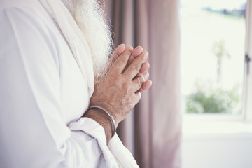 Indian Sikh religious items and hands close up