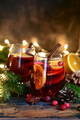 Red spicy christmas mulled wine with cranberries, apple and orange.