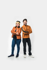 Indian couple in winter wear /warm clothes against white background