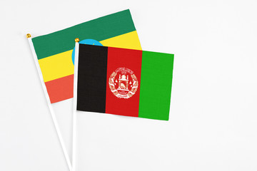 Afghanistan and Ethiopia stick flags on white background. High quality fabric, miniature national...