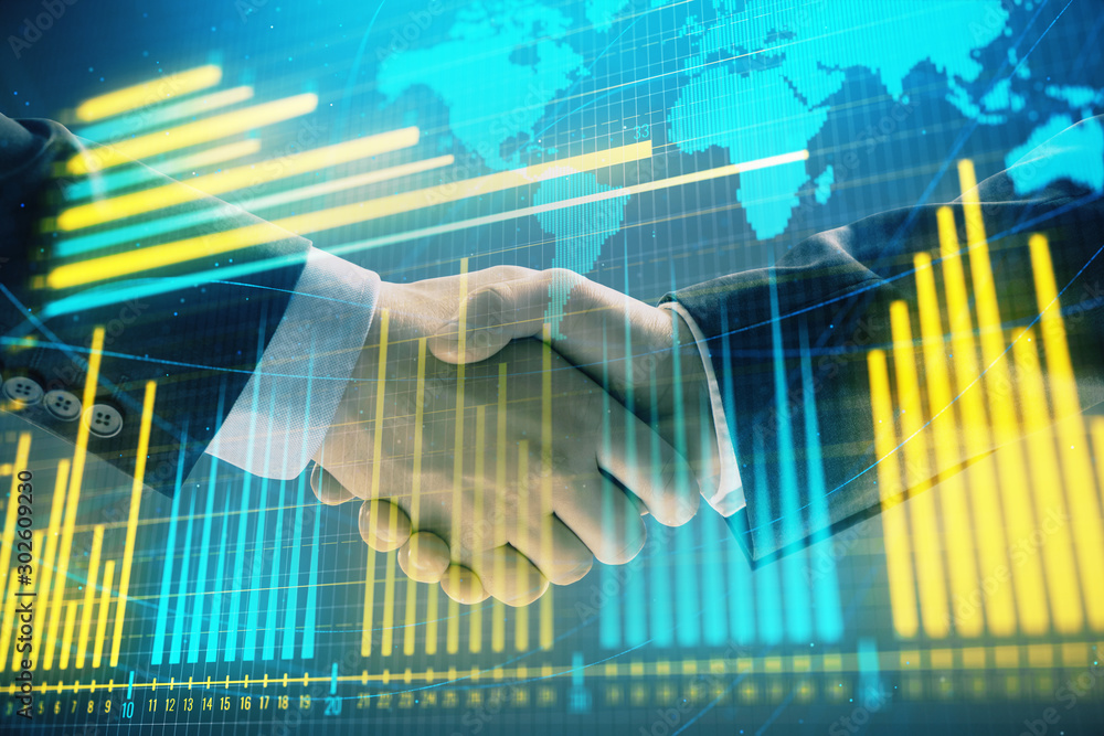 Wall mural multi exposure of forex graph and world map on abstract background with two businessmen handshake. c