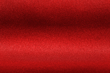 Rich red glitter texture as background.