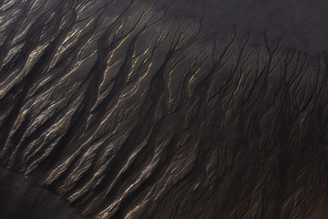 Abstract wet sand at the beach in Essaouira.