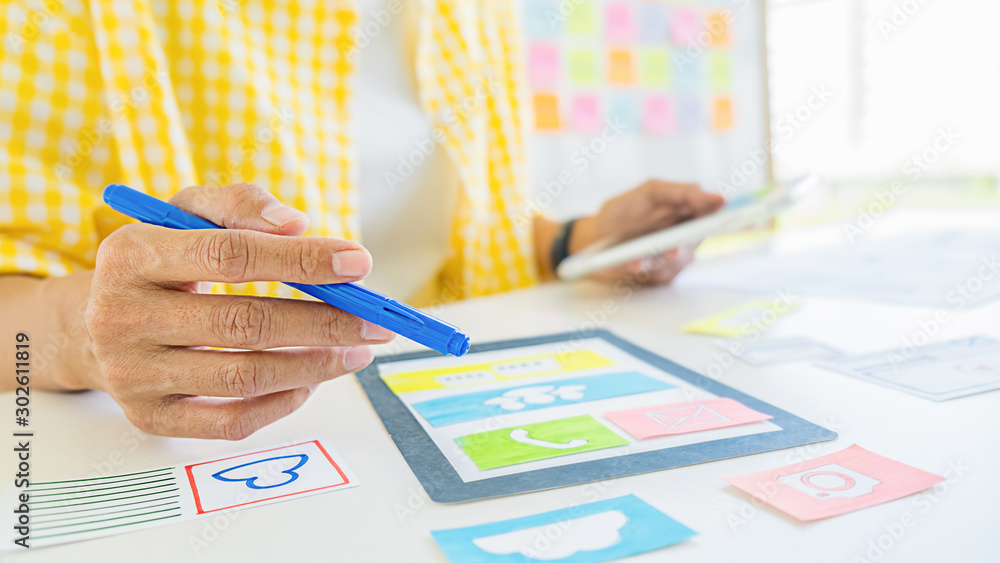 Wall mural creative web designer planning application and developing template layout, framework for mobile phon