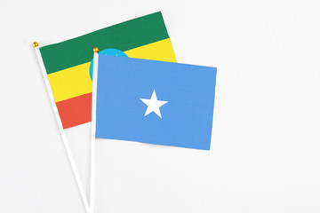 Somalia and Ethiopia stick flags on white background. High quality fabric, miniature national flag. Peaceful global concept.White floor for copy space.