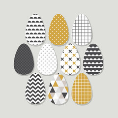 Cute Scandinavian Easter eggs card with geometric tribal ornament in black, white and gold colors of ethnic patterns