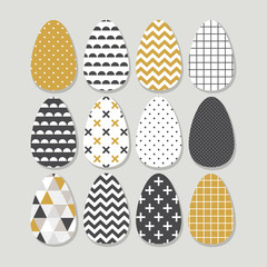 Cute Scandinavian Easter eggs card with geometric tribal ornament in black, white and gold colors of ethnic patterns