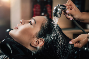 Young Woman Having Hair Washed in Salon