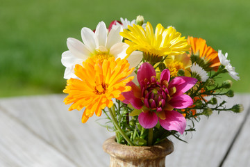 autumnal colorful bunch of flowers with asters, calendula and dahlias