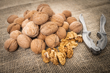 Walnut kernel background. Nutcracker with walnut