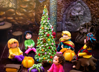 Display of children sit around christmas tree. Gingerbread Lane, a festive display of tasty-looking Christmas gingerbread creations in Hyatt Regency hotel downtown Vancouver in December. Selected focu