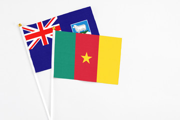 Cameroon and Falkland Islands stick flags on white background. High quality fabric, miniature...