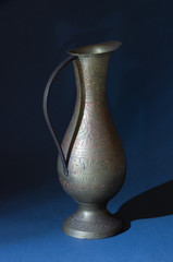 Jug, antique, bronze, gold pattern, vase on a blue background. 1