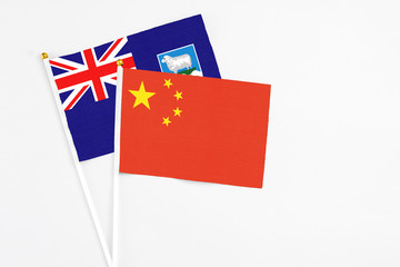 China and Falkland Islands stick flags on white background. High quality fabric, miniature national flag. Peaceful global concept.White floor for copy space.