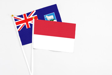 Indonesia and Falkland Islands stick flags on white background. High quality fabric, miniature national flag. Peaceful global concept.White floor for copy space.