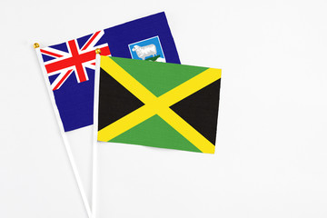 Jamaica and Falkland Islands stick flags on white background. High quality fabric, miniature...