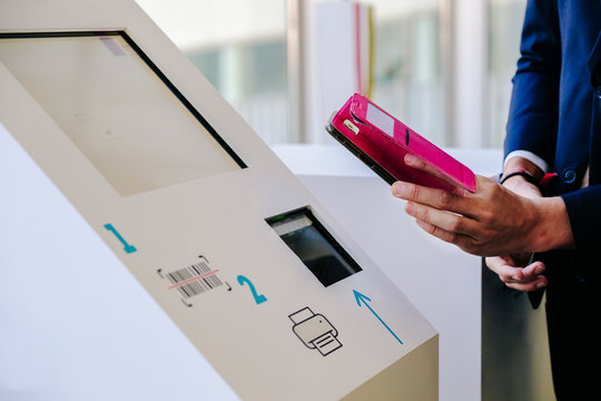 A mobile phone scans a QR code on an information computer in a congress