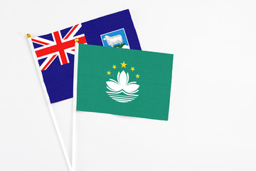 Macao and Falkland Islands stick flags on white background. High quality fabric, miniature national flag. Peaceful global concept.White floor for copy space.
