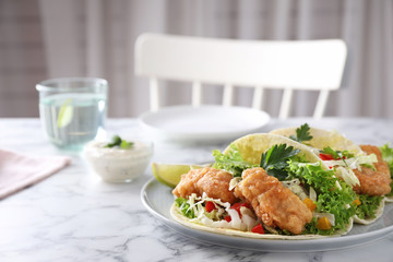 Yummy fish tacos served on white marble table, space for text
