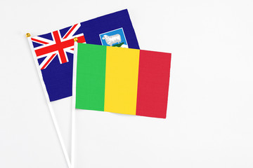 Mali and Falkland Islands stick flags on white background. High quality fabric, miniature national flag. Peaceful global concept.White floor for copy space.