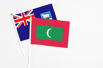 Maldives and Falkland Islands stick flags on white background. High quality fabric, miniature...