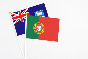 Portugal and Falkland Islands stick flags on white background. High quality fabric, miniature national flag. Peaceful global concept.White floor for copy space.
