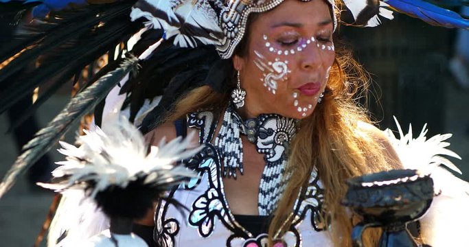 Woman with ceremonial traditional dress at Mexican Dia de los Muertos or Day of the Dead celebration, 4K