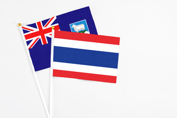 Thailand and Falkland Islands stick flags on white background. High quality fabric, miniature...