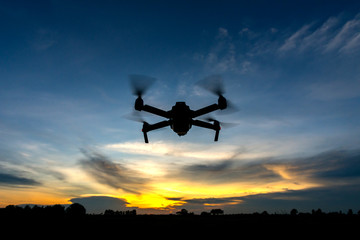 Flying drone and cloud sky